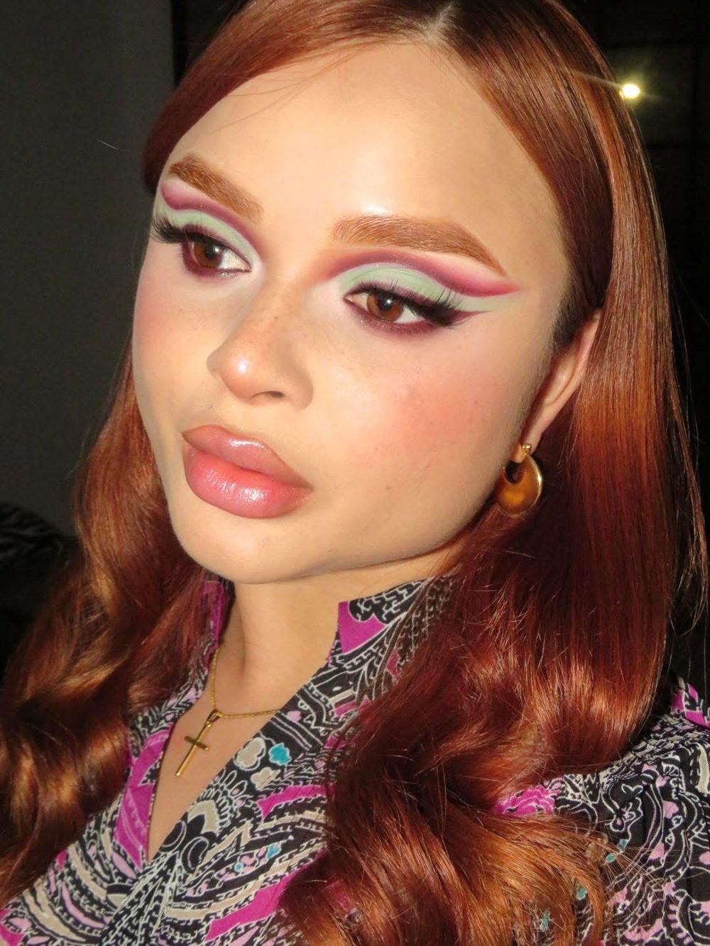 Mint and pink graphic liner with a soft pink lip